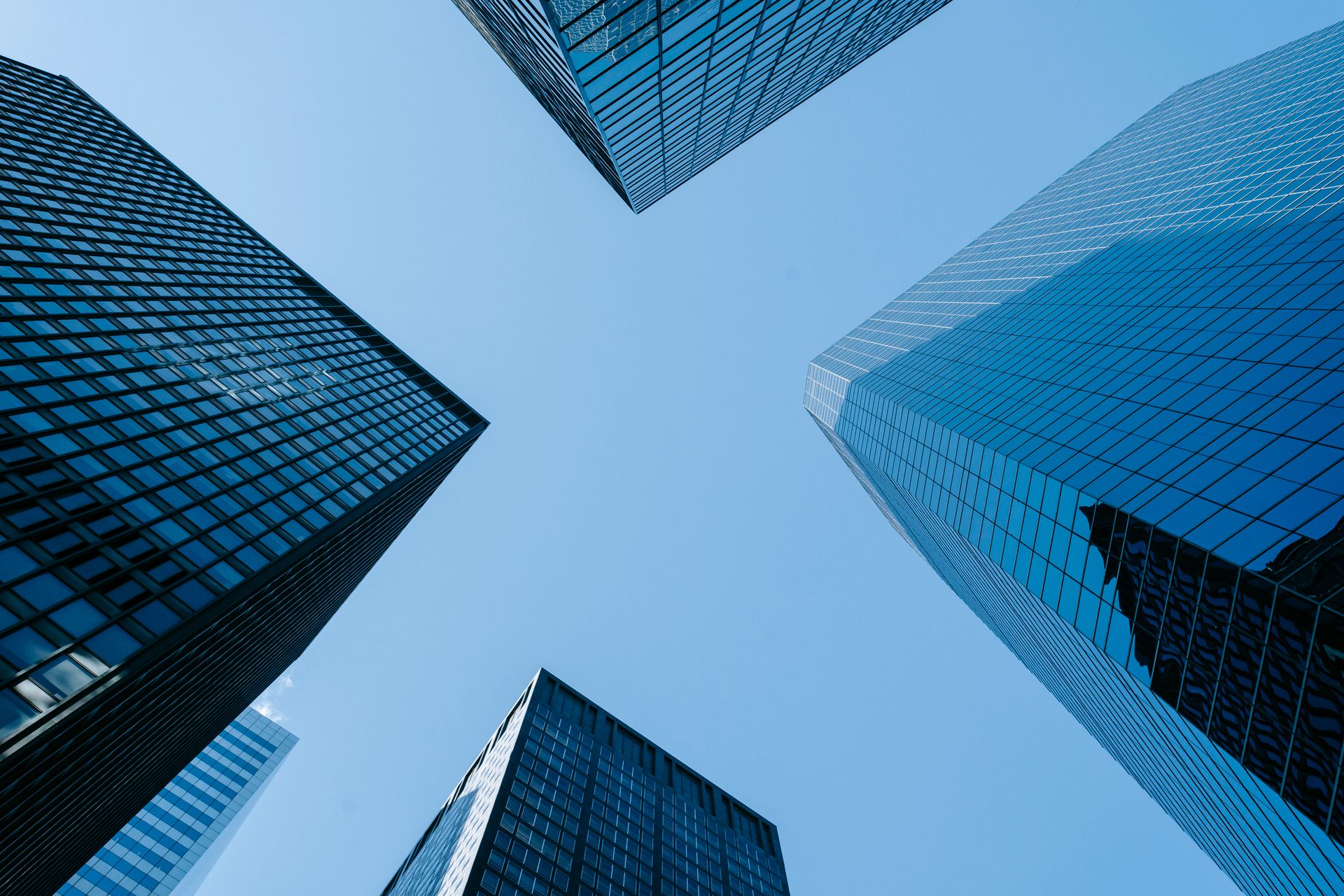 Glass office towers representing Nexum Forge delivery locations in Europe