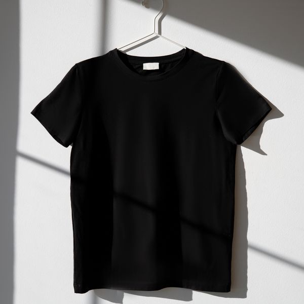 Black cotton tee on a hanger